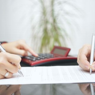male and female signing document