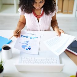woman holding financial documents