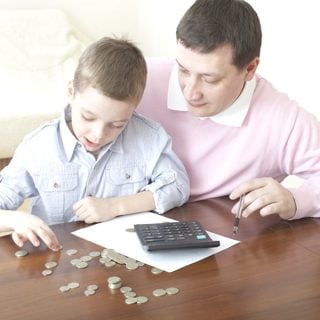 father and son counting money