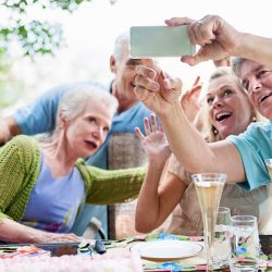 group of senior citizens taking a photo