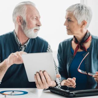 Seniors discussing annuity for retirement