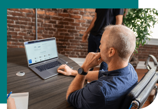 Man thinking working on laptop