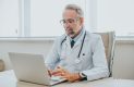 Doctor sitting at a computer