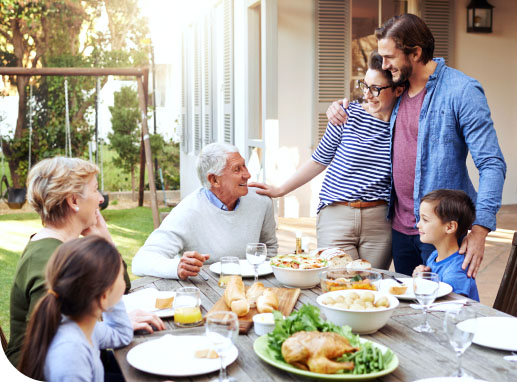 Family outside enjoying a meal