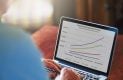 Man managing retirement plan on laptop