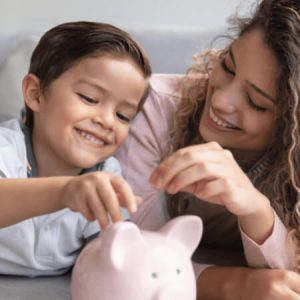 Mother and son saving money in a piggybank