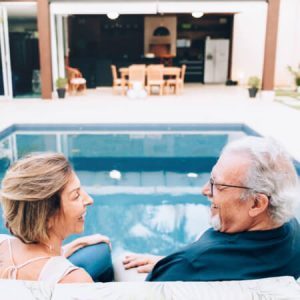 Elderly couple at a pool