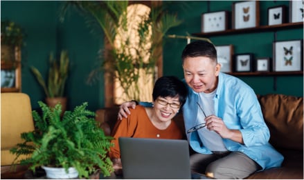 A couple using a laptop