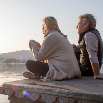 Older couple looks at sunrise