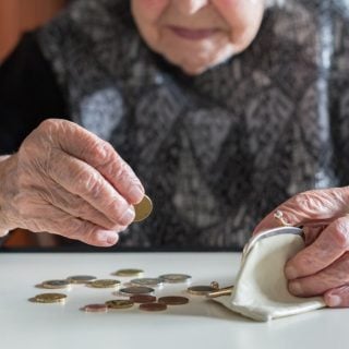 Elderly woman counting change