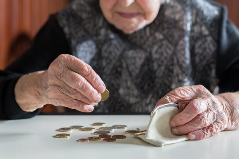 Elderly woman counting change