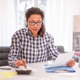 Woman using calculator