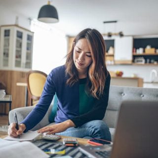 Woman looking at tax papers