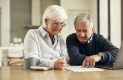 Older couple reviewing finances and paperwork