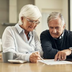 Older couple reviewing finances and paperwork