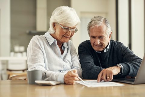 Older couple reviewing finances and paperwork