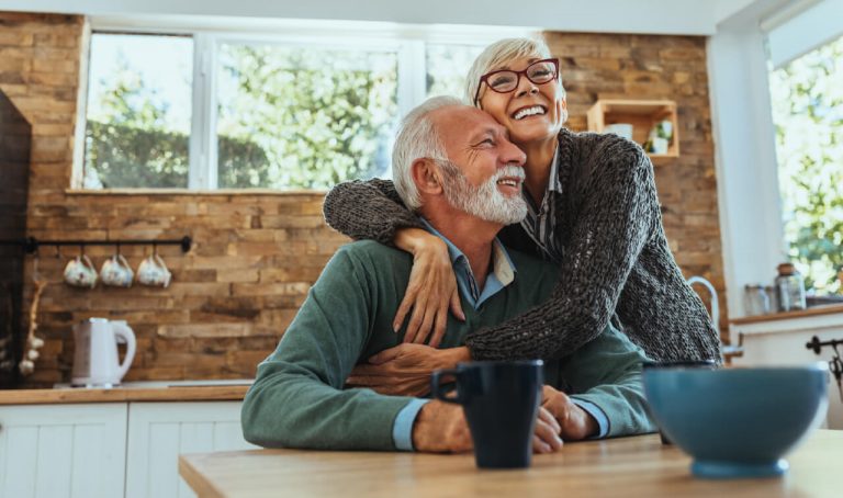 photo showing an older couple embracing