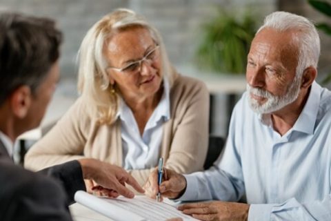 two people talking to a lawyer