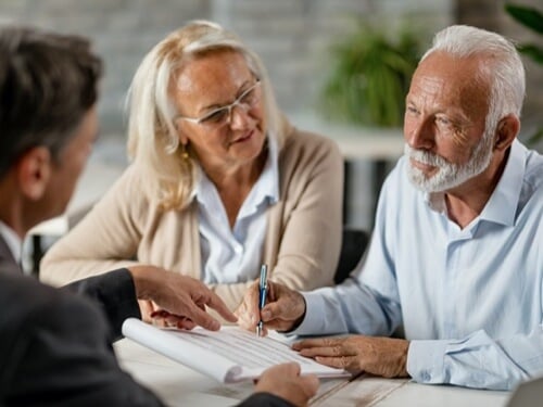 two people talking to a lawyer