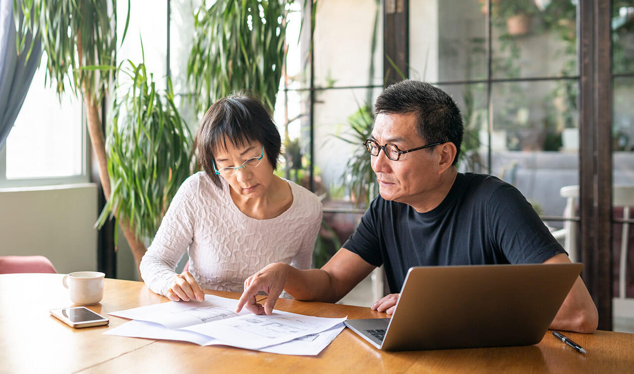 Couple reviewing papers together