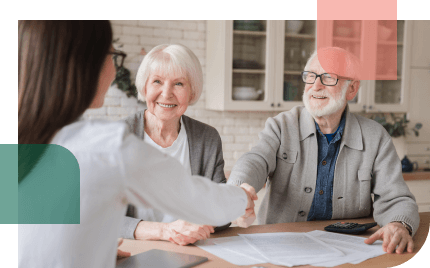 Older couple meeting with a financial advisor to see which payout option makes sense for them