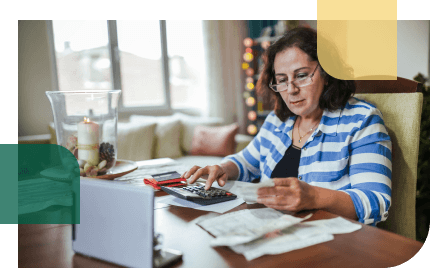Older woman reviews her financial situation to see if an annuity is right for her, or if she should consider an alternative to annuities