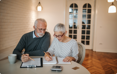 Senior couple reviewing their finances at home