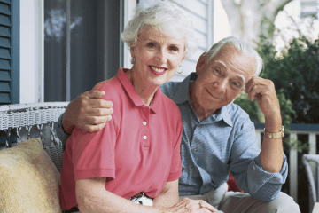 Retired couple relaxing on their porch