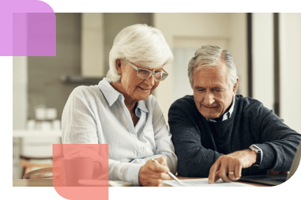 senior couple reviews their pension plans together