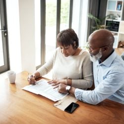 Senior couple preparing financial paperwork