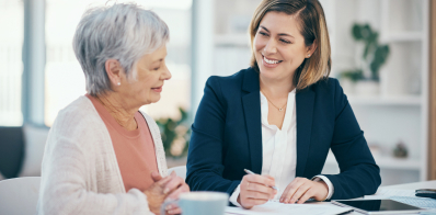 Smiling financial advisor talking to retiree